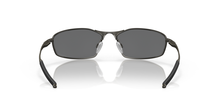 Pair of Oakley sunglasses with replacement ear socks in a reflective surface.