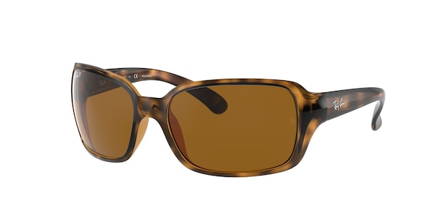 A pair of Ray-Ban sunglasses with a patterned frame and dark lenses.