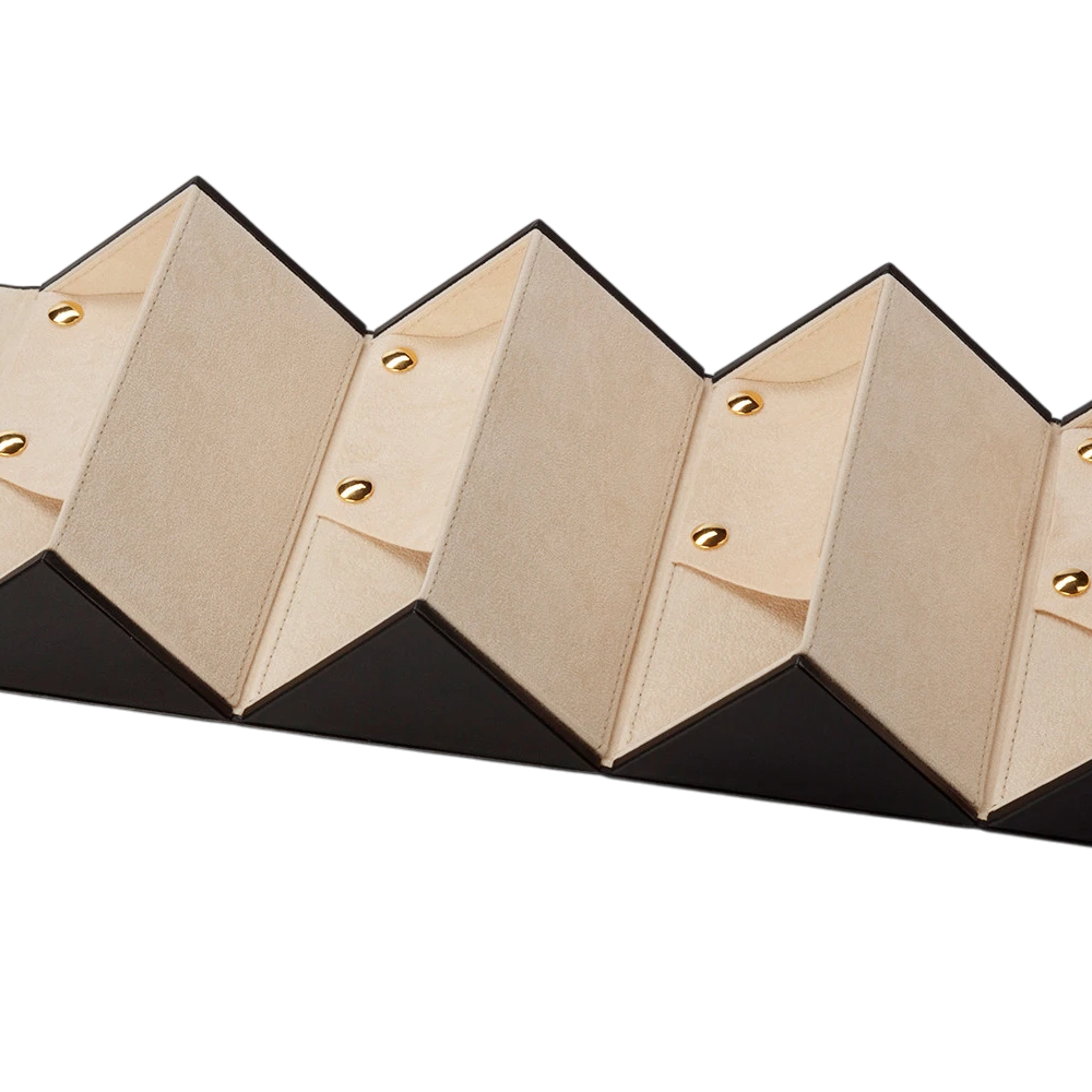 Geometric wall light fixture with black and gold design on a white background