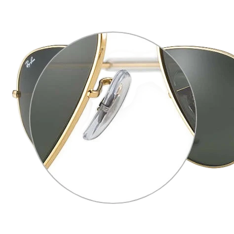Close-up view of Ray-Ban sunglasses showcasing the replacement nose pads and the brand's logo on the side.