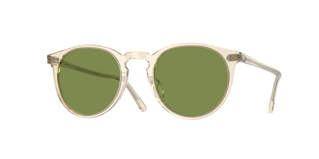 Round sunglasses with green lenses and gold frames on a white background