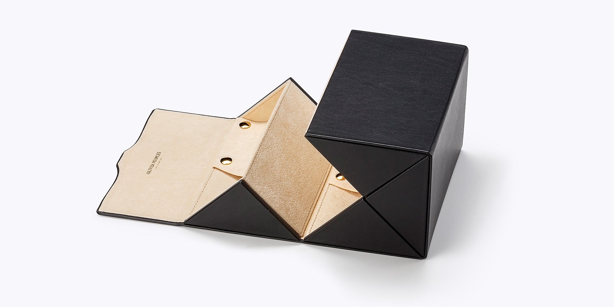 Black and gold geometric jewelry box on a white background