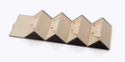 Geometric wall light fixture with black and gold design on a white background