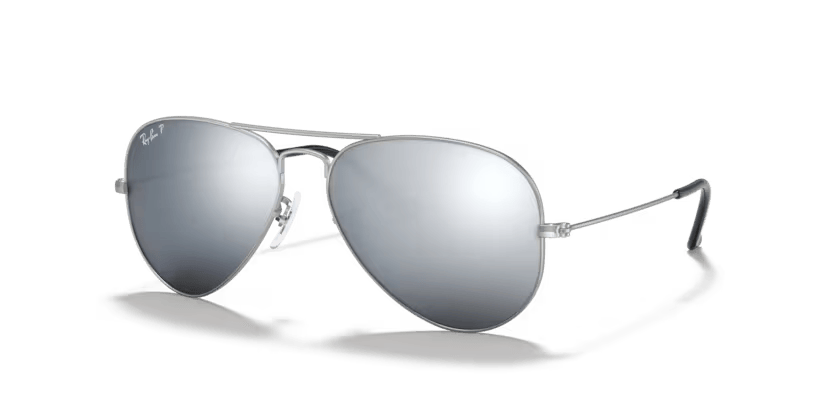 A pair of Ray-Ban sunglasses with green lenses and a gold frame, known for their aviator style.