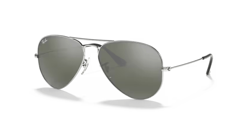 A pair of Ray-Ban sunglasses with green lenses and a gold frame, known for their aviator style.