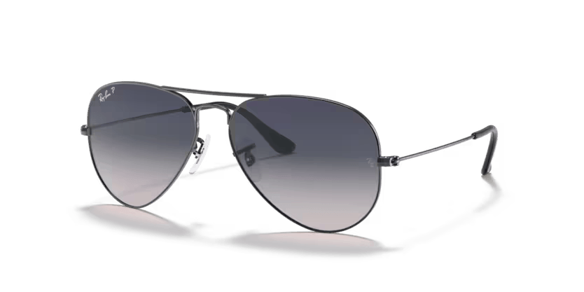 A pair of Ray-Ban sunglasses with green lenses and a gold frame, known for their aviator style.