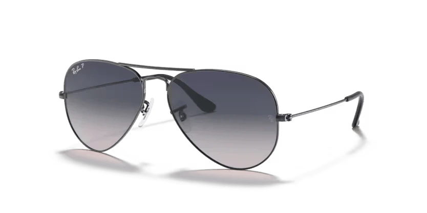 A pair of Ray-Ban sunglasses with green lenses and a gold frame, known for their aviator style.