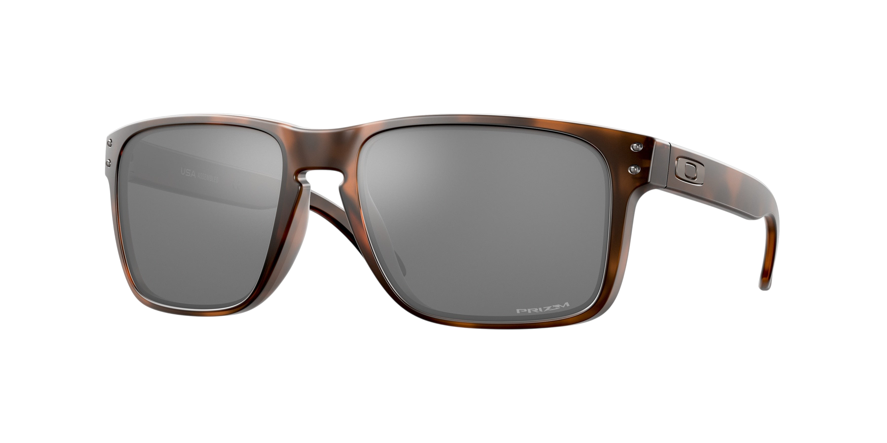 Sunglasses UK Oakley Holbrook XL sunglasses in tortoise shell frame with grey Prizm lenses, side profile view.